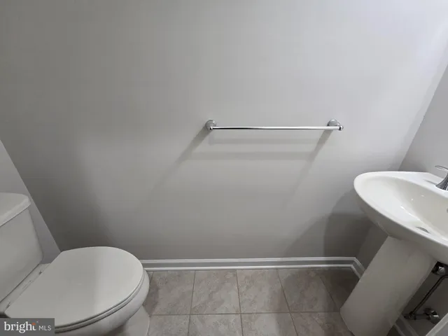 a bathroom with a toilet and a sink
