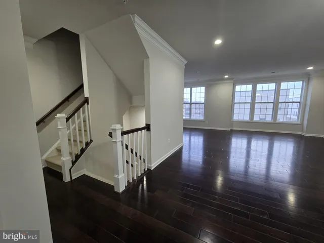 a view of an entryway with wooden floor