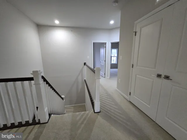 a view of a hallway with staircase