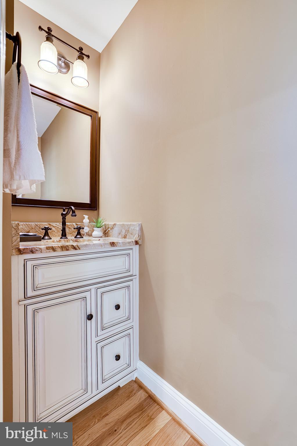 11056 Thrush Ridge Road Reston, VA 20191 - Photo 12 of 62 a bathroom with a sink vanity and a mirror