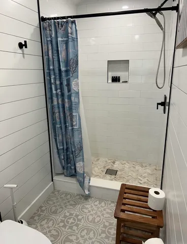 a bathroom with a sink and a shower