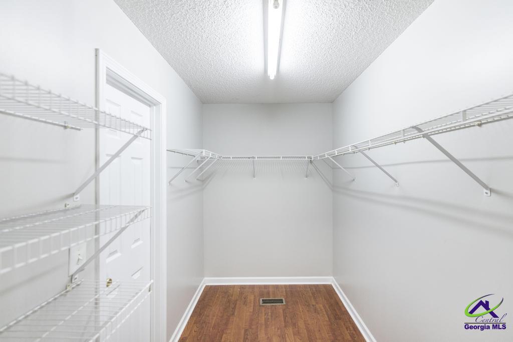 110 Arbor Climb Road Macon, GA 31210 - Photo 23 of 42 a view of walk in closet with empty racks
