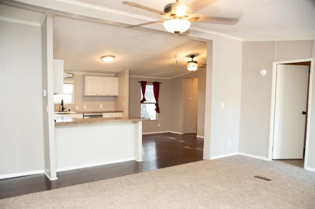 a view of a kitchen with a sink and cabinet area