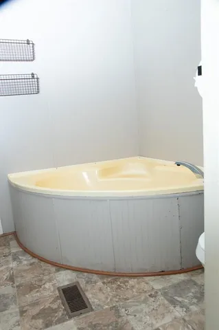 a view of a bathtub in a bathroom
