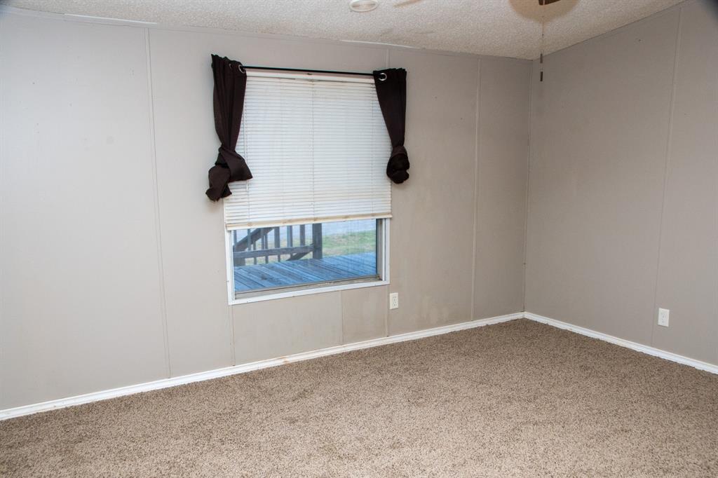 289 Belle Place Springtown, TX 76082 - Photo 16 of 17 an empty room with a window