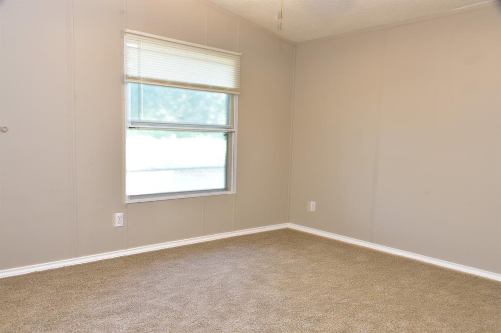 289 Belle Place Springtown, TX 76082 - Photo 17 of 17 an empty room with a window