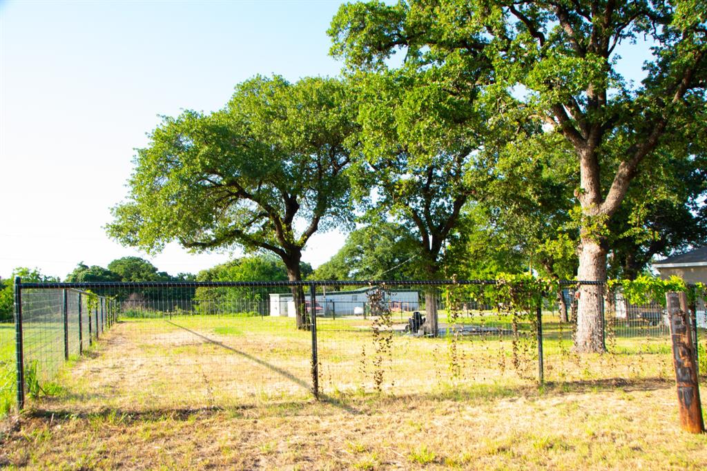 289 Belle Place Springtown, TX 76082 - Photo 4 of 17 a view of a swimming pool with an outdoor space and seating area