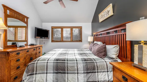 a view of a dining room with furniture a chandelier and wooden floor