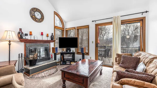 a bedroom with a bed and a lamp on table