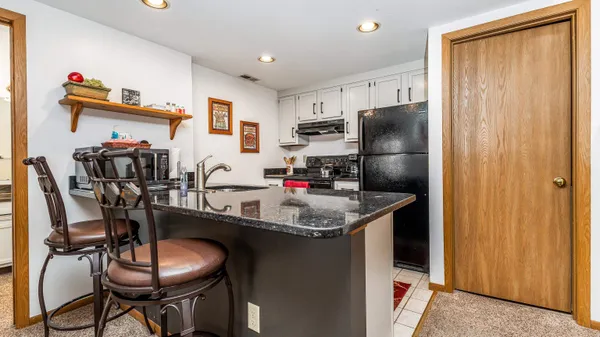 a bedroom with two beds and a large window