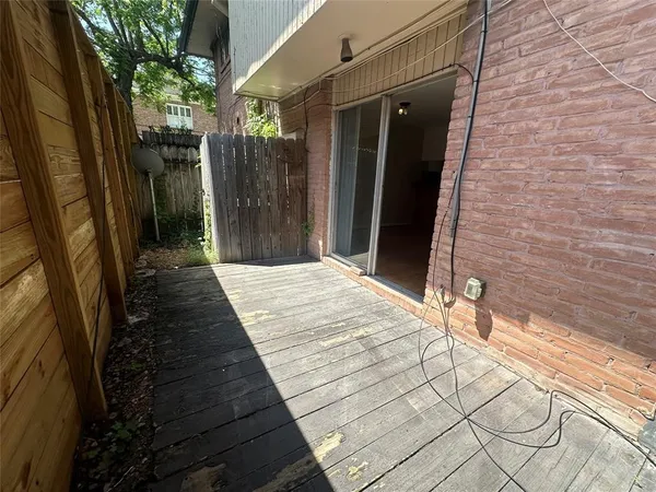 an empty room with wooden floor and closet
