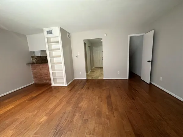 a view of entryway with wooden floor and stairs