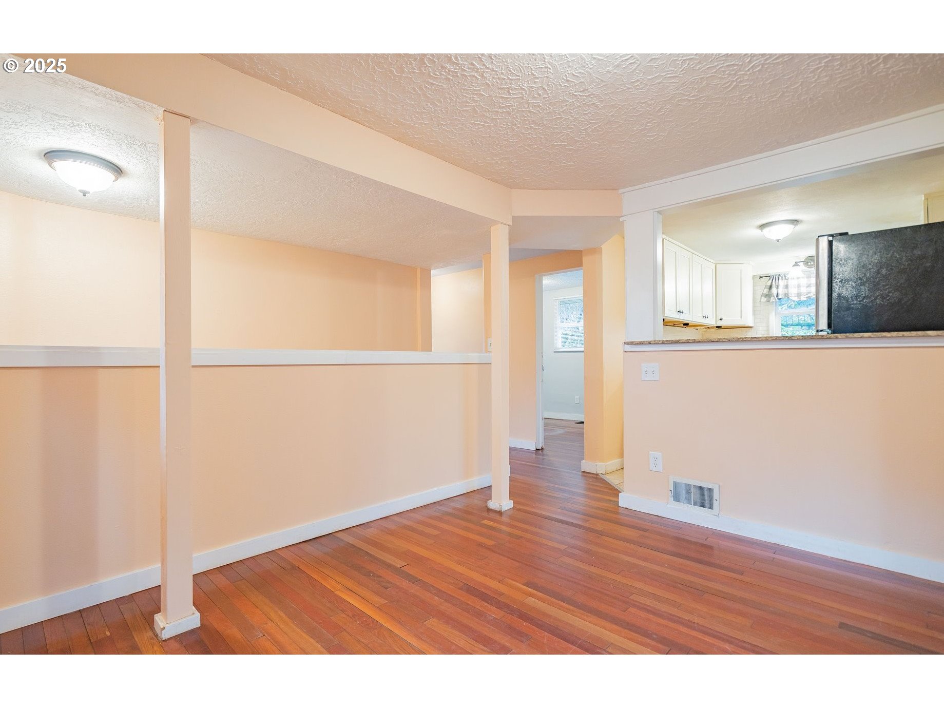 3915 I Street Vancouver, WA 98663 - Photo 5 of 20 a view of empty room with wooden floor