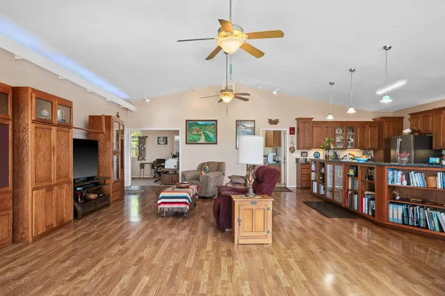 a living room with lots of furniture and a flat screen tv