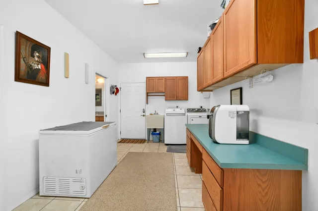 a kitchen with sink cabinets and window