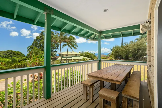 a view of a balcony with chairs