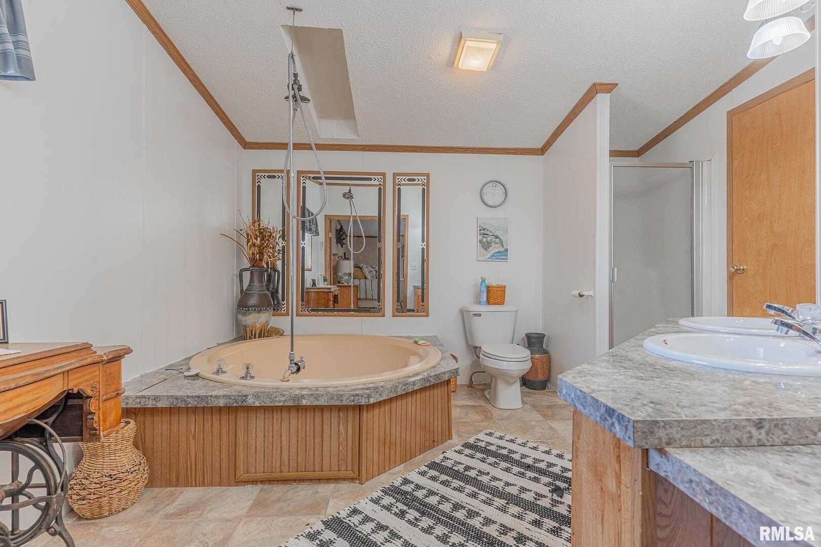 565 Dutton Chapel Road Herod, IL 62947 - Photo 51 of 54 a bathroom with a granite countertop sink and a bathtub