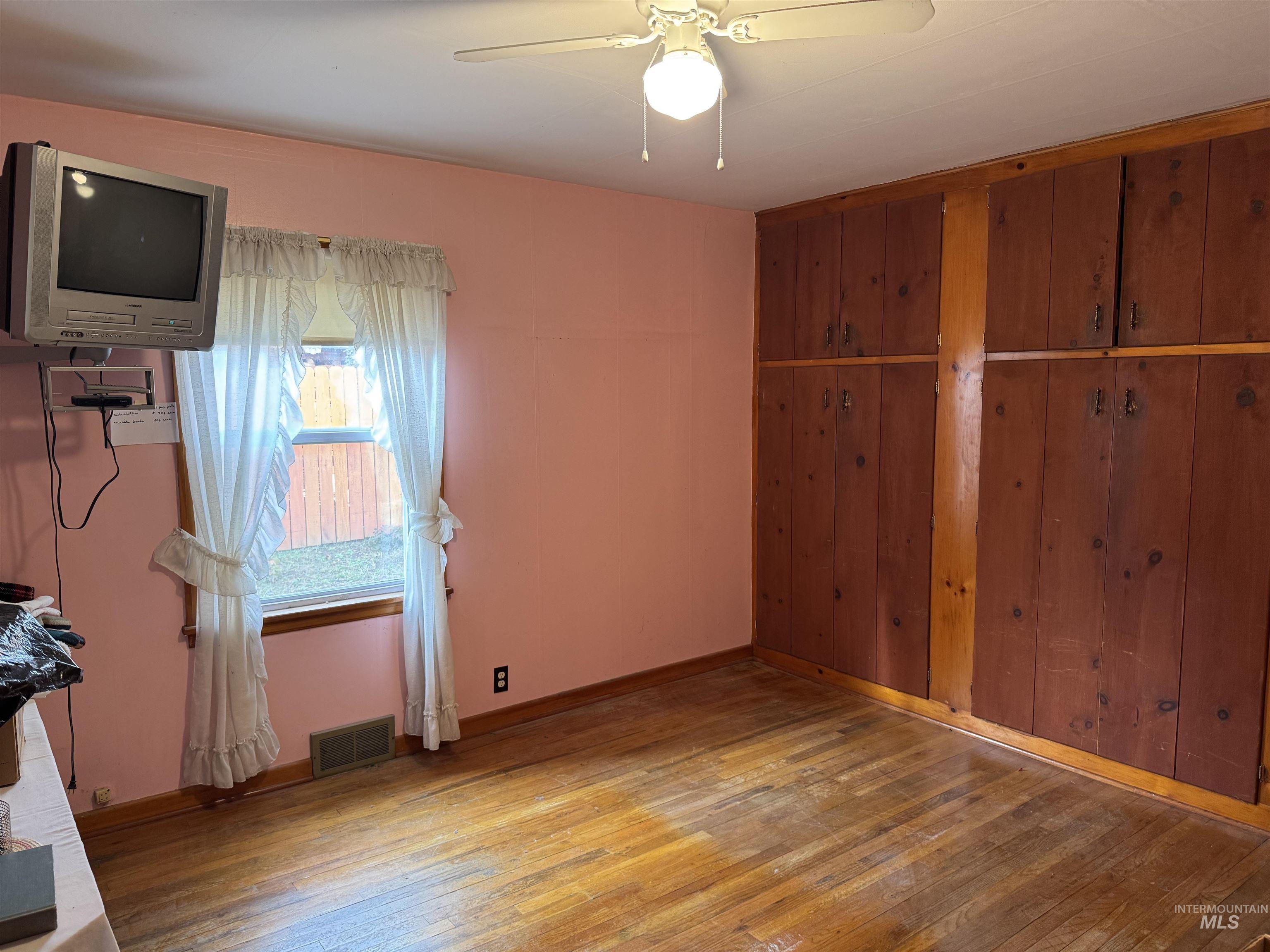 1109 3rd Street Kamiah, ID 83536 - Photo 11 of 17 Bedroom featuring light wood finished floors and a ceiling fan