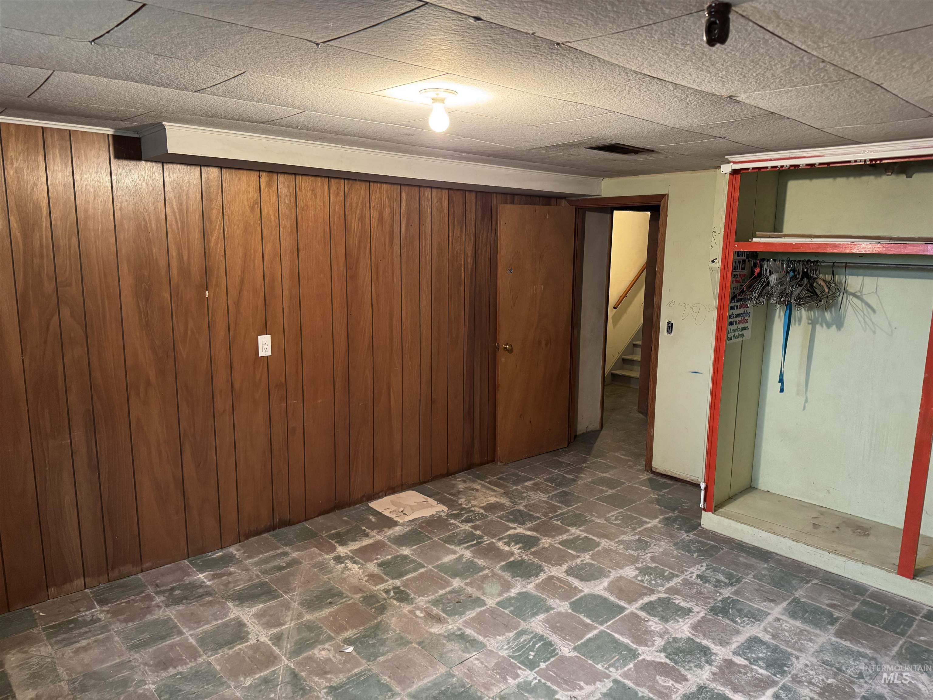 1109 3rd Street Kamiah, ID 83536 - Photo 16 of 21 Finished basement with stairway and wooden walls