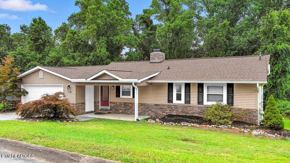 front view of a house with a yard
