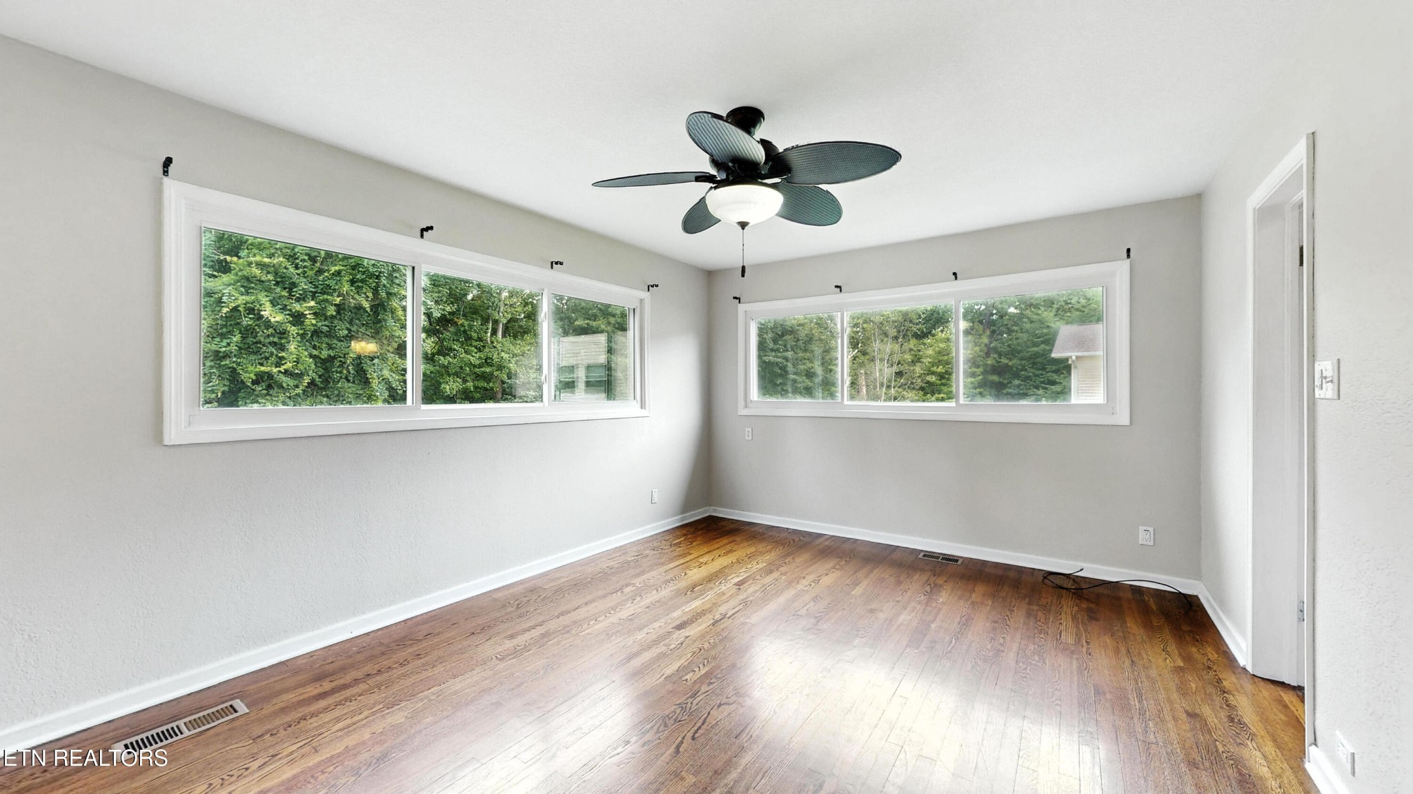 110 Ogden Circle Oak Ridge, TN 37830 - Photo 11 of 50 a view of empty room with wooden floor and fan