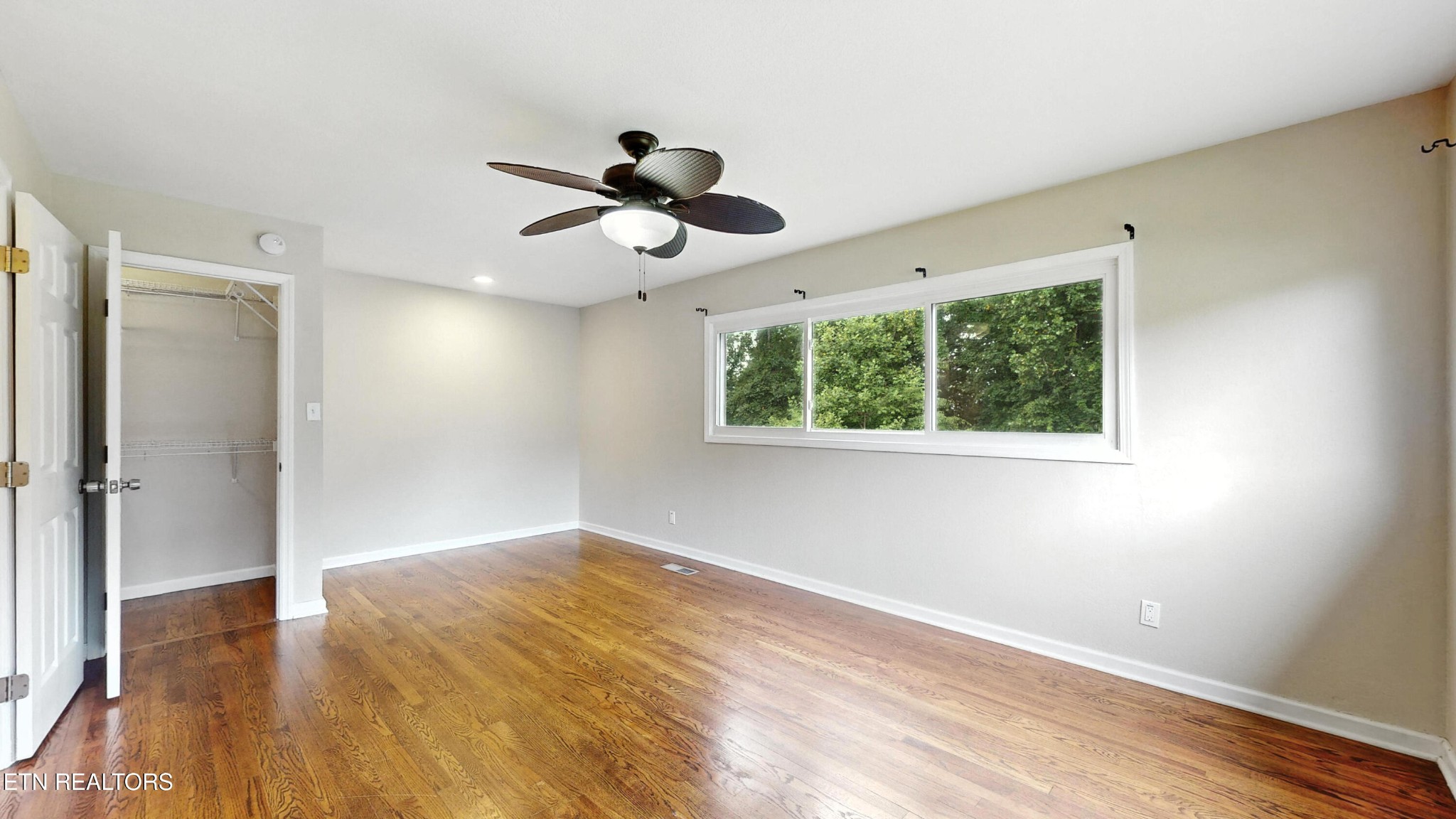 110 Ogden Circle Oak Ridge, TN 37830 - Photo 14 of 50 a view of empty room with wooden floor and fan