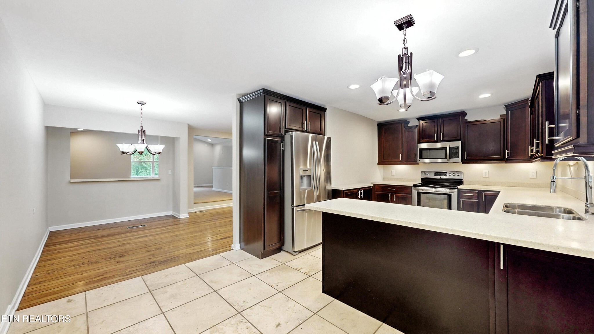 110 Ogden Circle Oak Ridge, TN 37830 - Photo 2 of 50 a kitchen with stainless steel appliances granite countertop a sink refrigerator and cabinets
