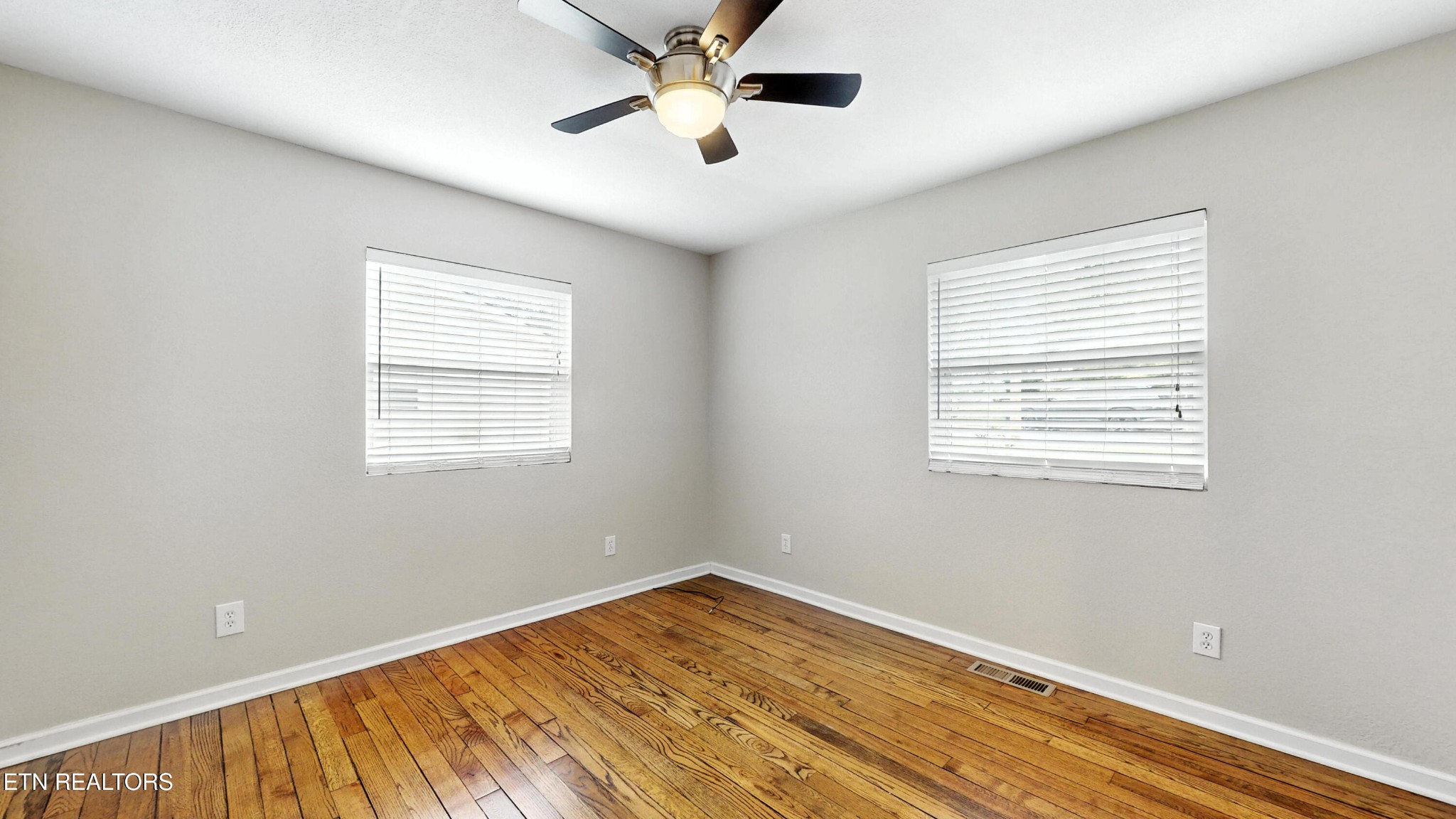 110 Ogden Circle Oak Ridge, TN 37830 - Photo 21 of 50 a view of empty room with wooden floor and fan
