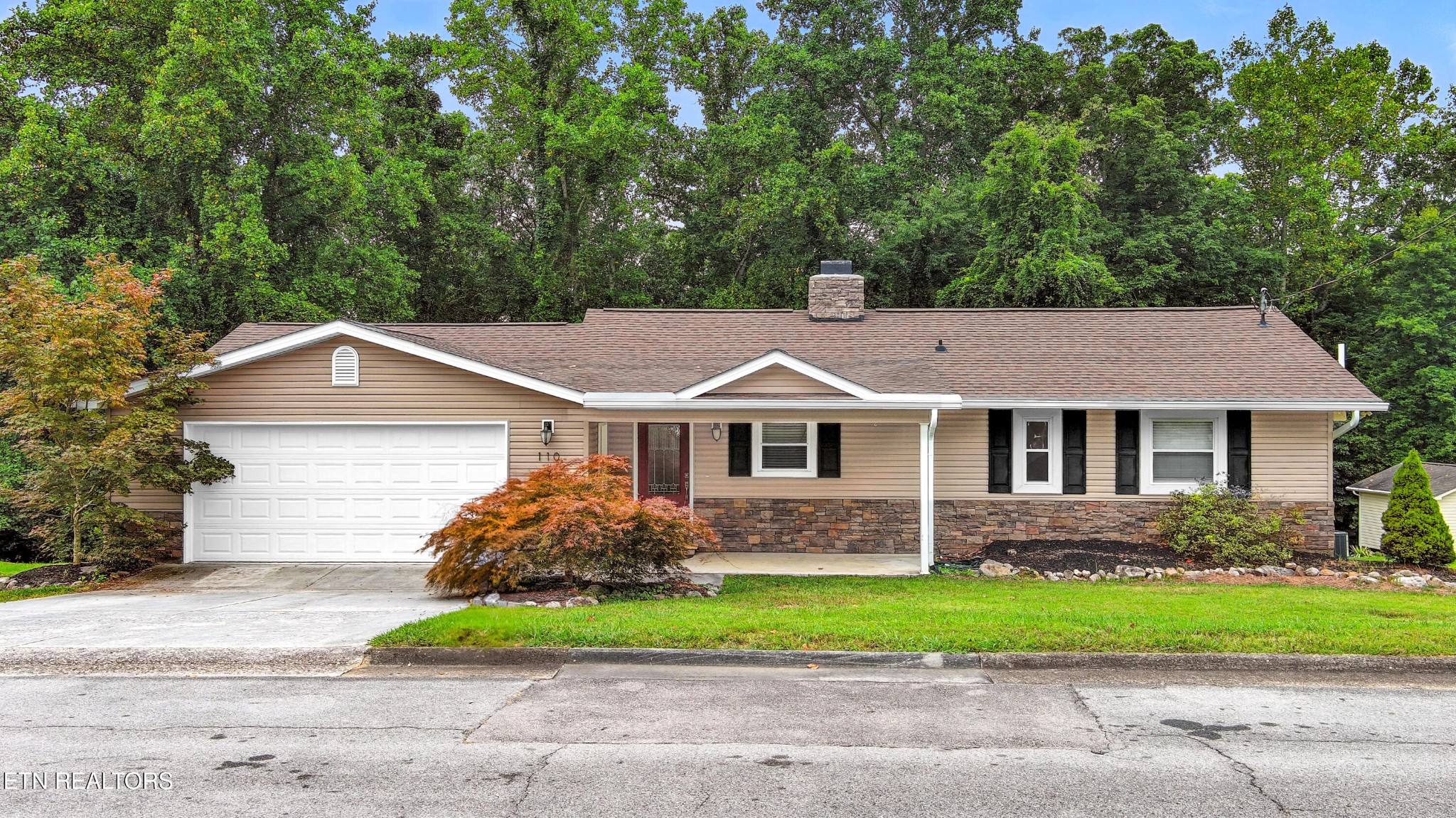 110 Ogden Circle Oak Ridge, TN 37830 - Photo 36 of 50 a front view of a house with a yard and garage