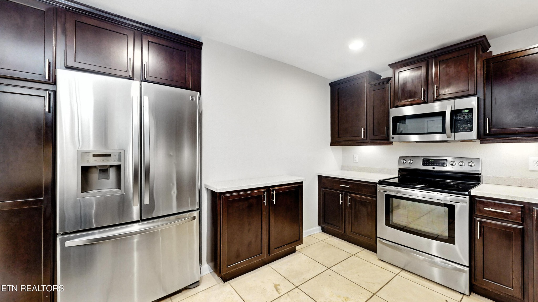 110 Ogden Circle Oak Ridge, TN 37830 - Photo 4 of 50 a kitchen with stainless steel appliances granite countertop a refrigerator and a stove top oven