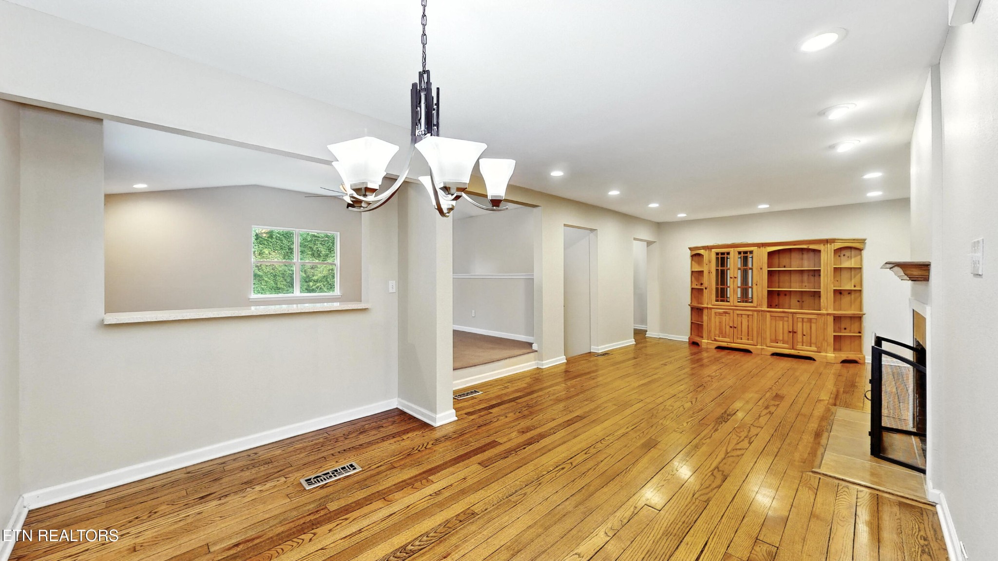 110 Ogden Circle Oak Ridge, TN 37830 - Photo 6 of 50 a view of an empty room with wooden floor and a window