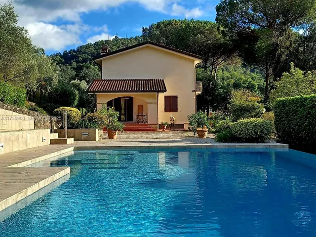 a view of swimming pool with outdoor seating and lake view