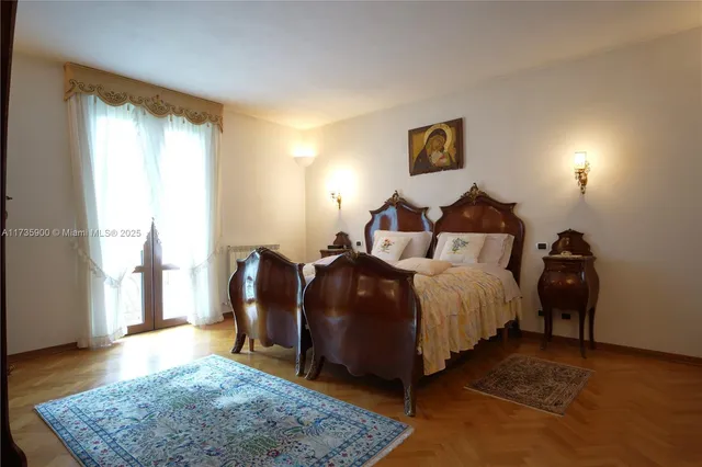 a bedroom with bed and window