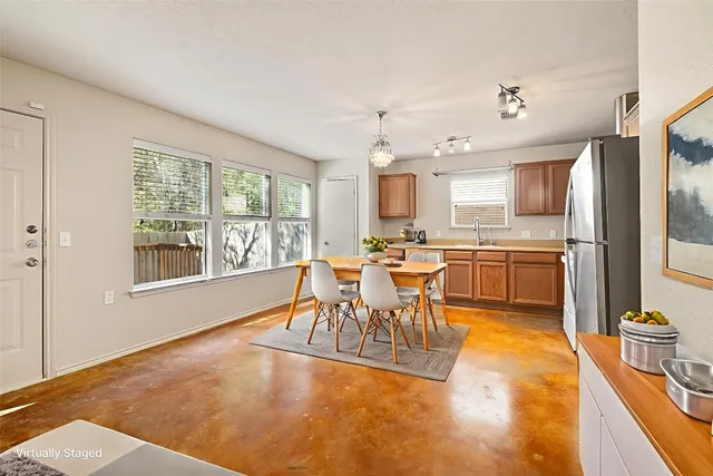 a living room with stainless steel appliances kitchen island granite countertop furniture and a kitchen view
