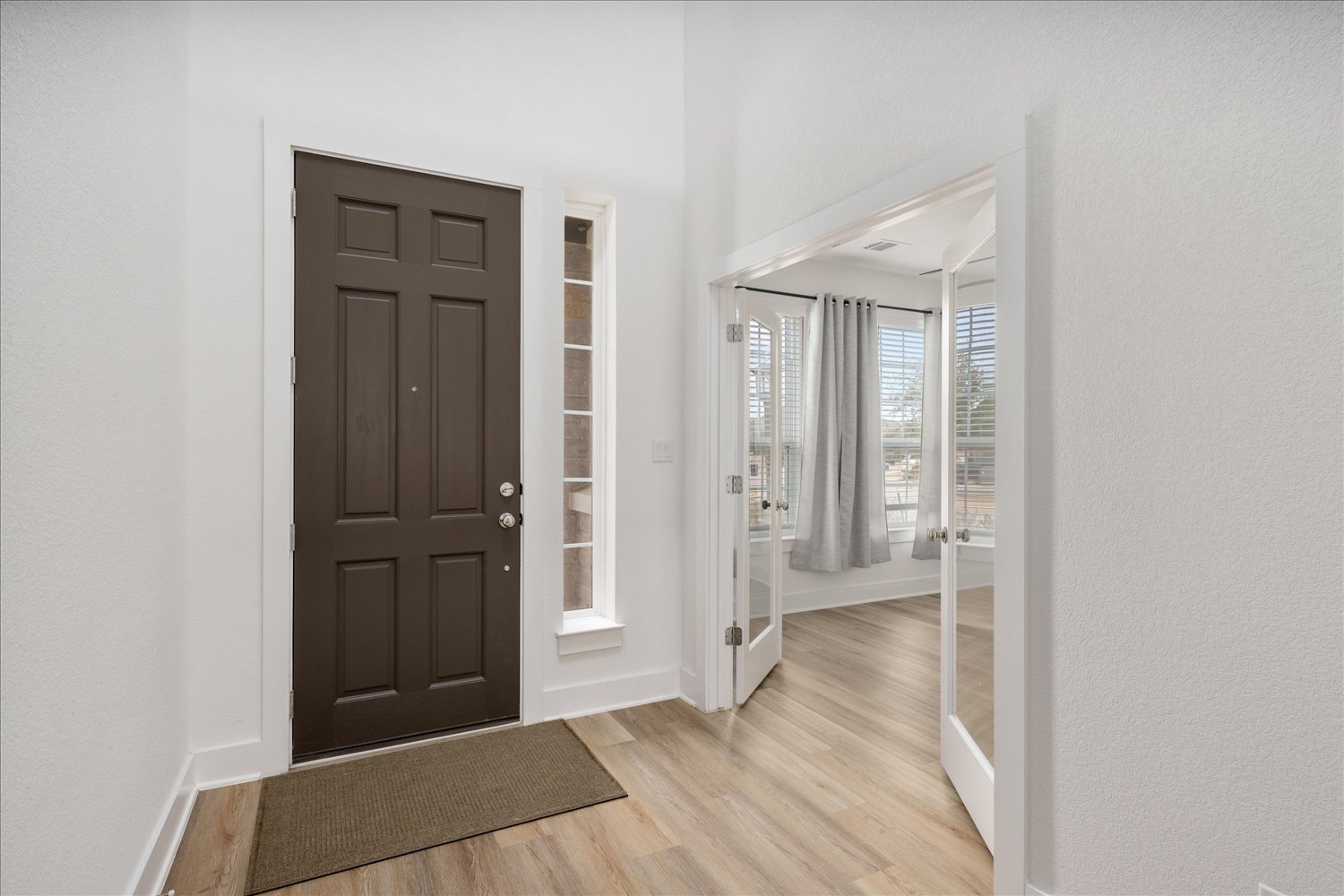3120 Pale Rider Pass Leander, TX 78641 - Photo 4 of 34 Foyer featuring light wood-style flooring and baseboards
