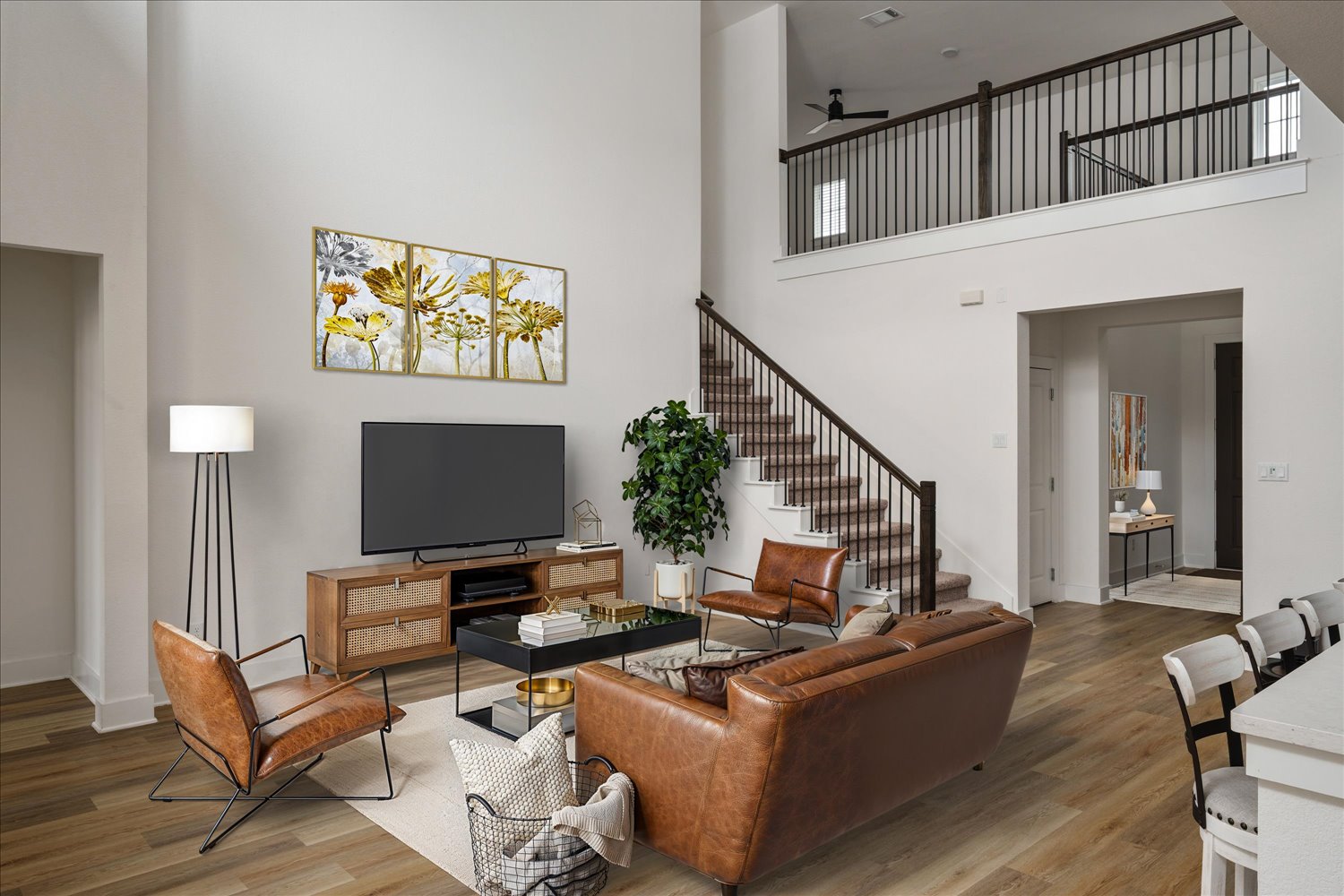 3120 Pale Rider Pass Leander, TX 78641 - Photo 6 of 34 Living area with a high ceiling, a ceiling fan, and wood finished floors