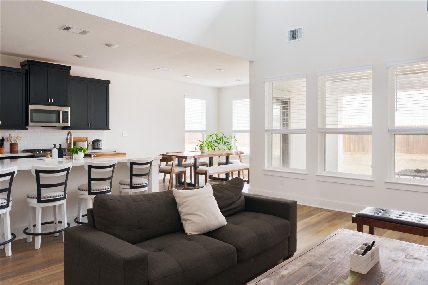 3120 Pale Rider Pass Leander, TX 78641 - Photo 9 of 34 Living area featuring dark wood-type flooring, a high ceiling, windows, and recessed lighting
