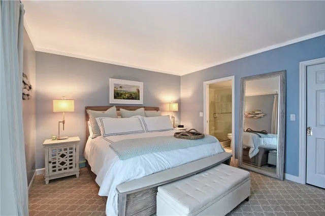 a bedroom with a bed and a dresser