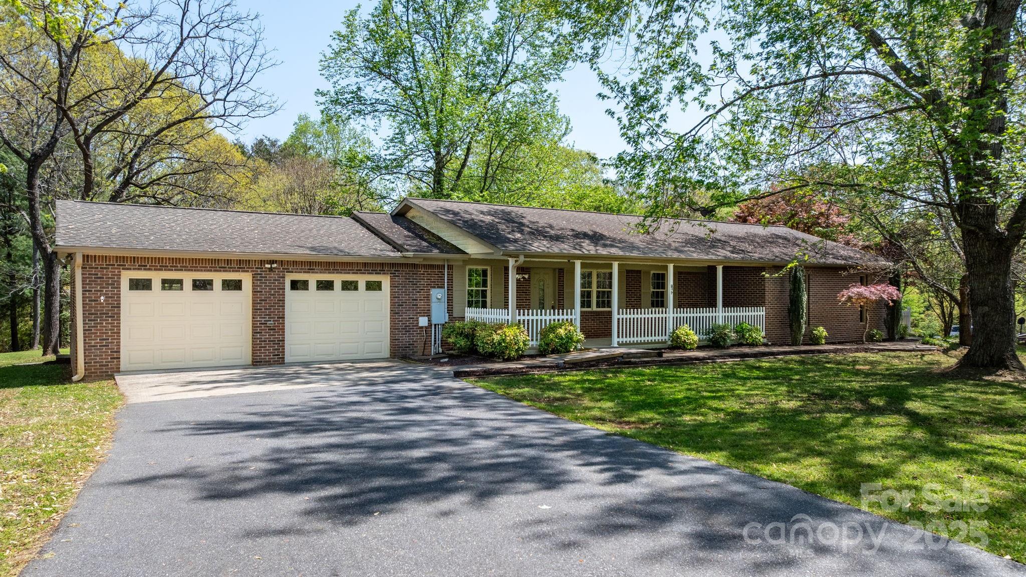 a front view of a house with a yard and porch