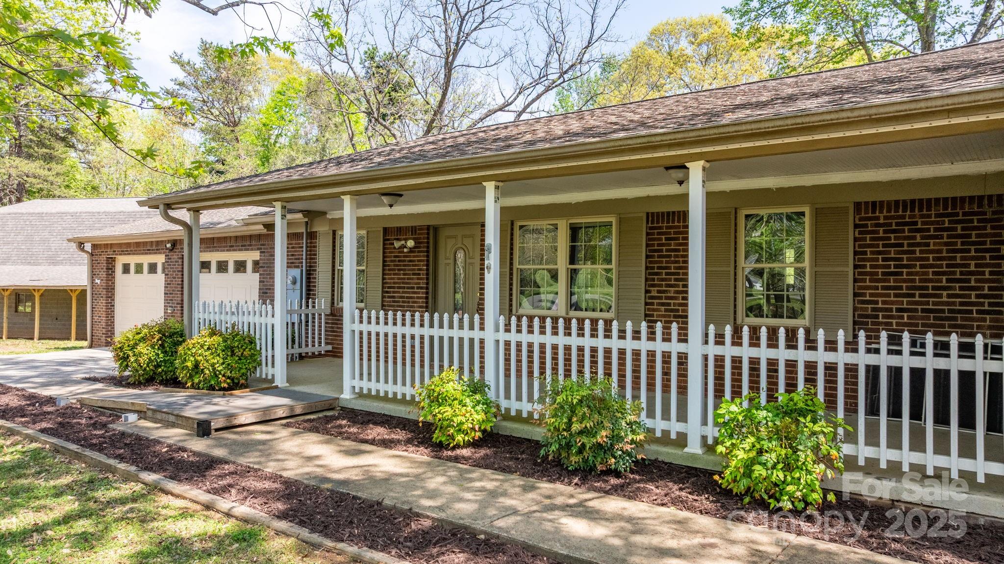 4067 Old Buff Road Hickory, NC 28602 - Photo 11 of 45 a front view of a house with a garden