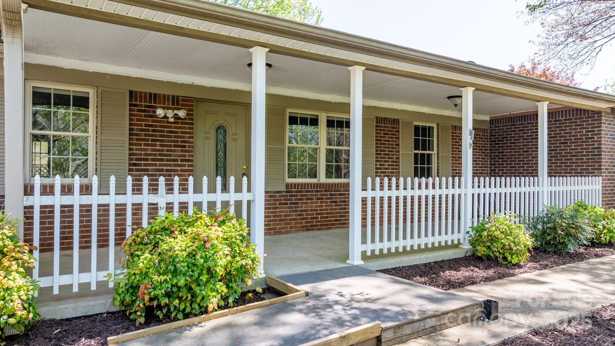4067 Old Buff Road Hickory, NC 28602 - Photo 13 of 45 a front view of a house with a porch
