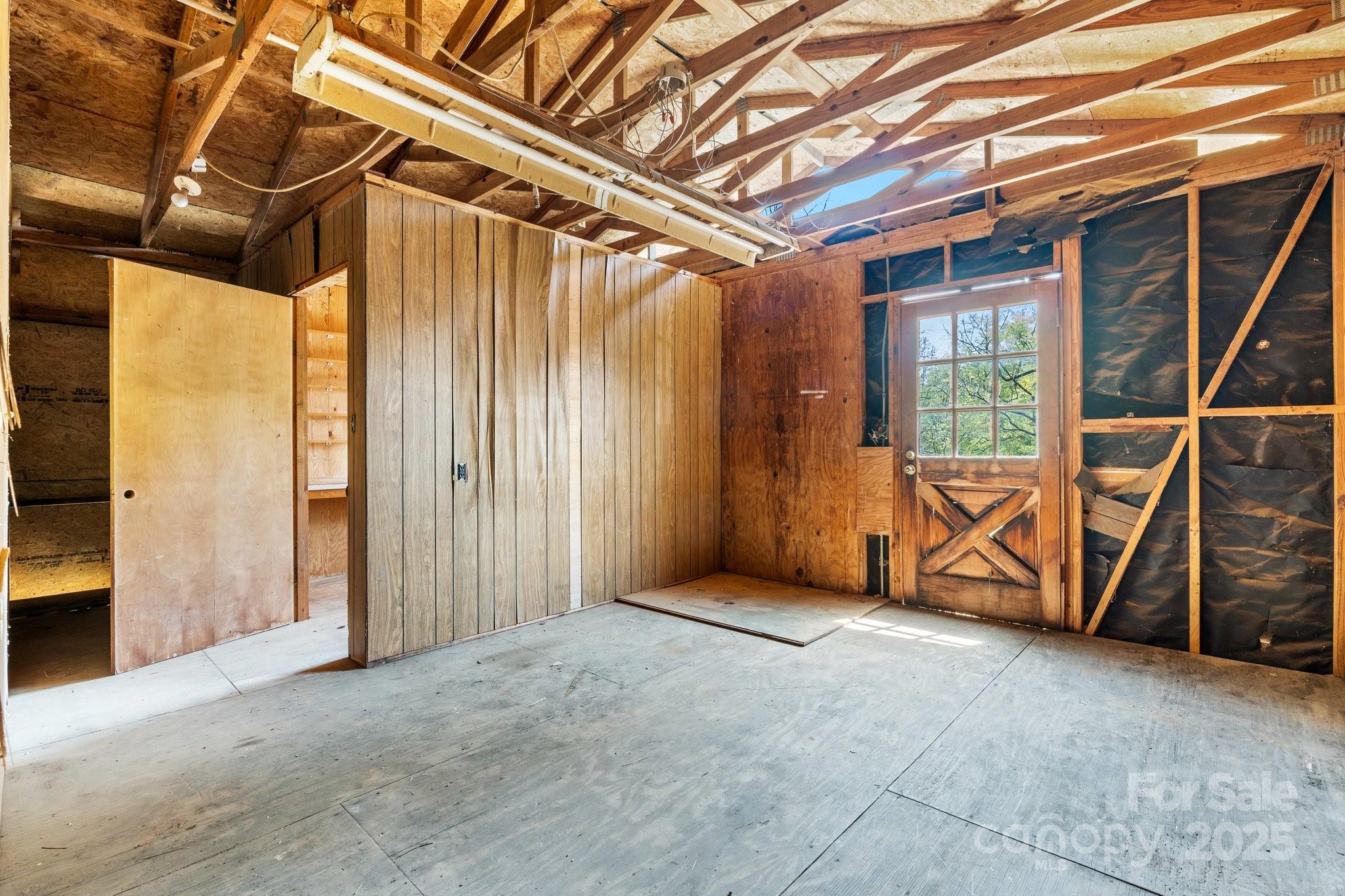 4067 Old Buff Road Hickory, NC 28602 - Photo 40 of 45 a view of an empty room with wooden walls