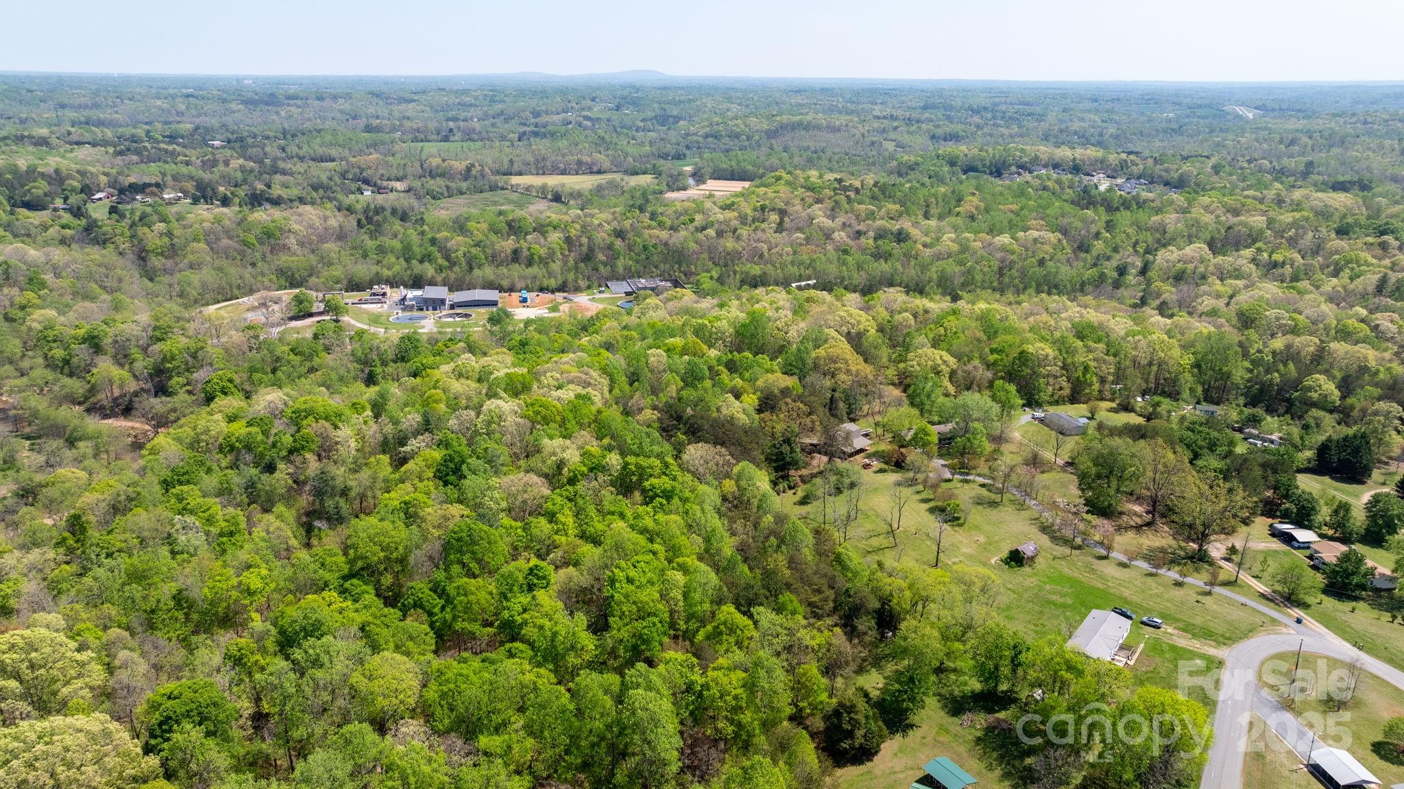 4067 Old Buff Road Hickory, NC 28602 - Photo 44 of 45 a view of a green field with lots of bushes