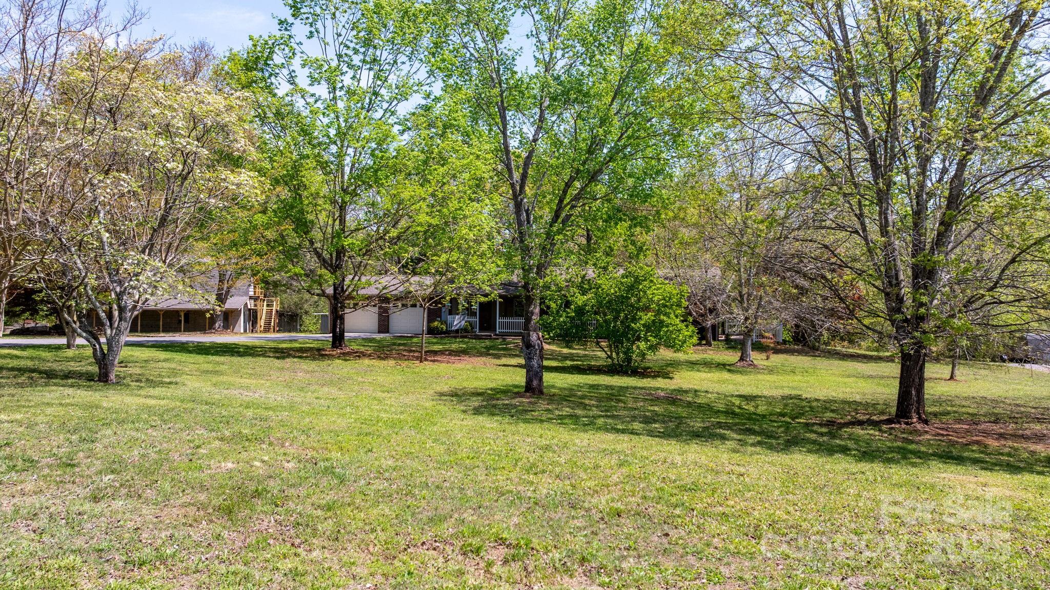 4067 Old Buff Road Hickory, NC 28602 - Photo 9 of 45 a garden with trees in the background