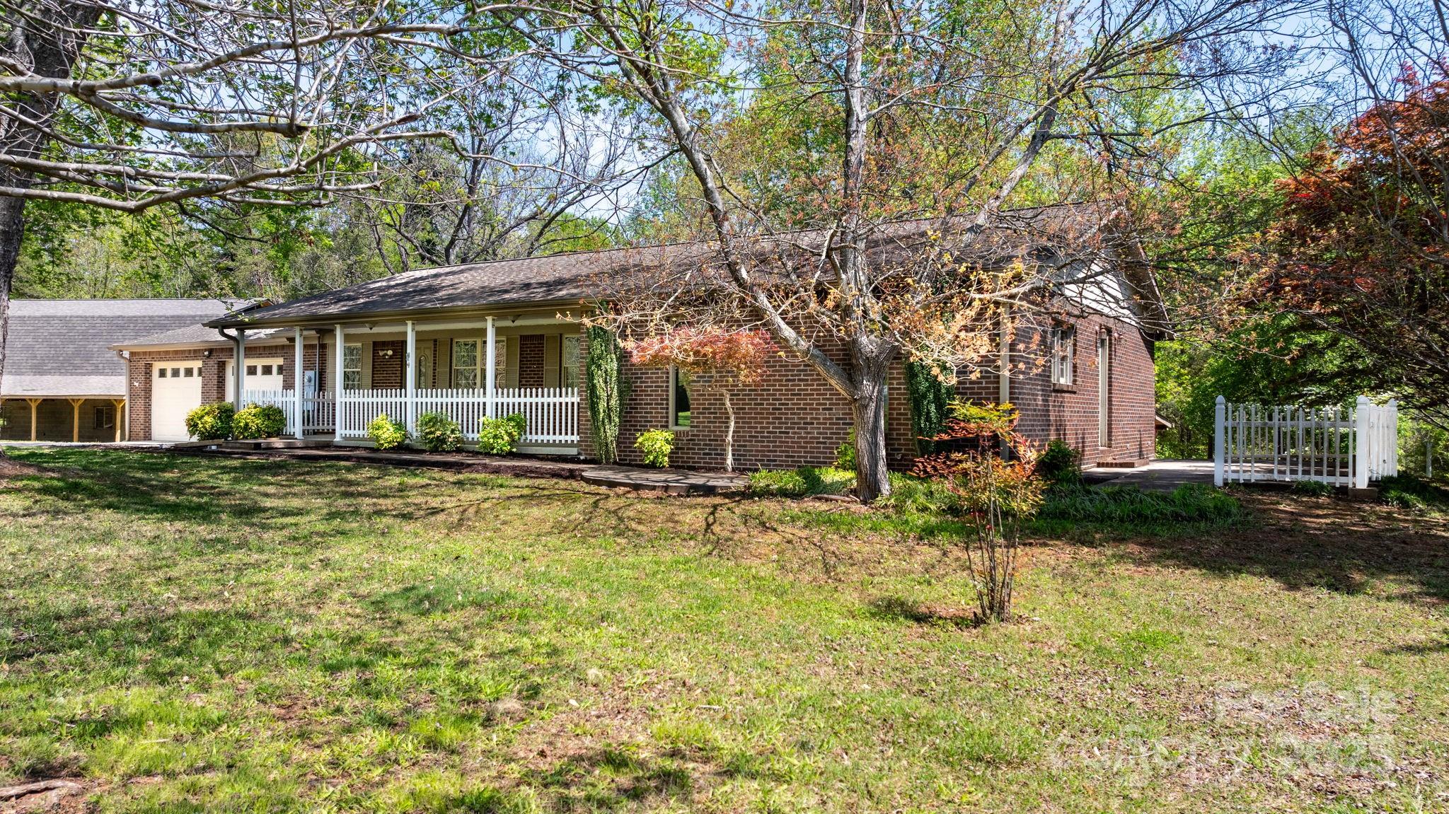 4067 Old Buff Road Hickory, NC 28602 - Photo 10 of 45 a backyard of a house with yard and tree