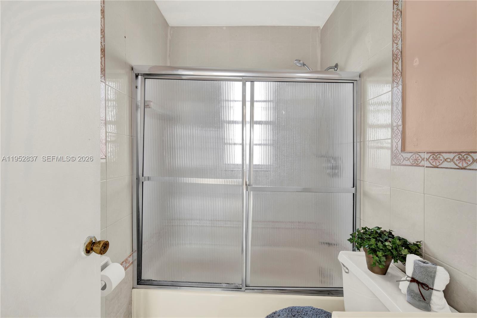 474 East 10th Street Hialeah, FL 33010 - Photo 11 of 38 a bathroom with a shower