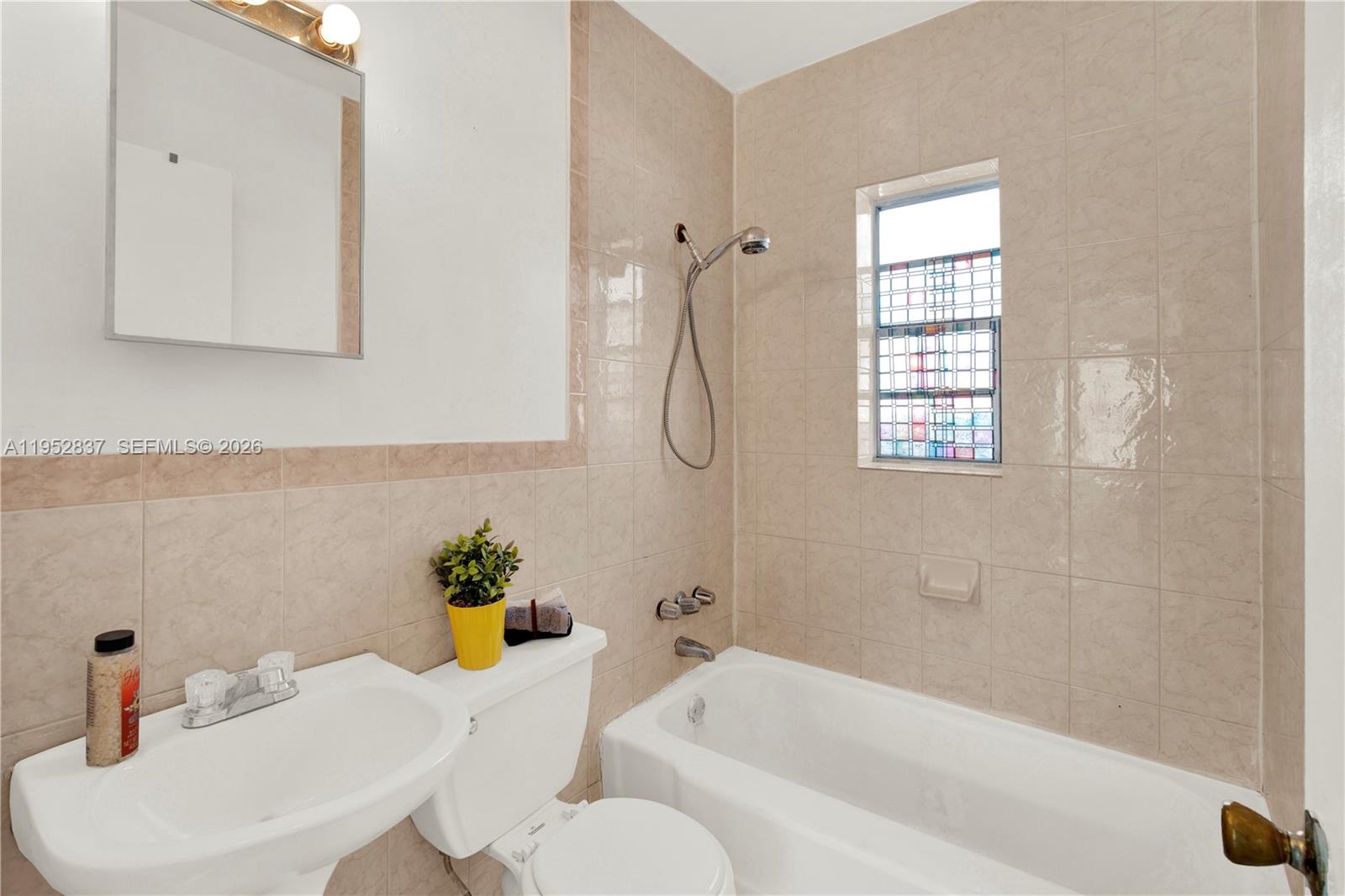 474 East 10th Street Hialeah, FL 33010 - Photo 12 of 38 a bath room with a sink and a bath tub