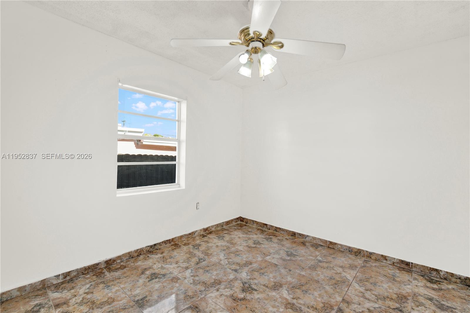 474 East 10th Street Hialeah, FL 33010 - Photo 14 of 38 an empty room with a window