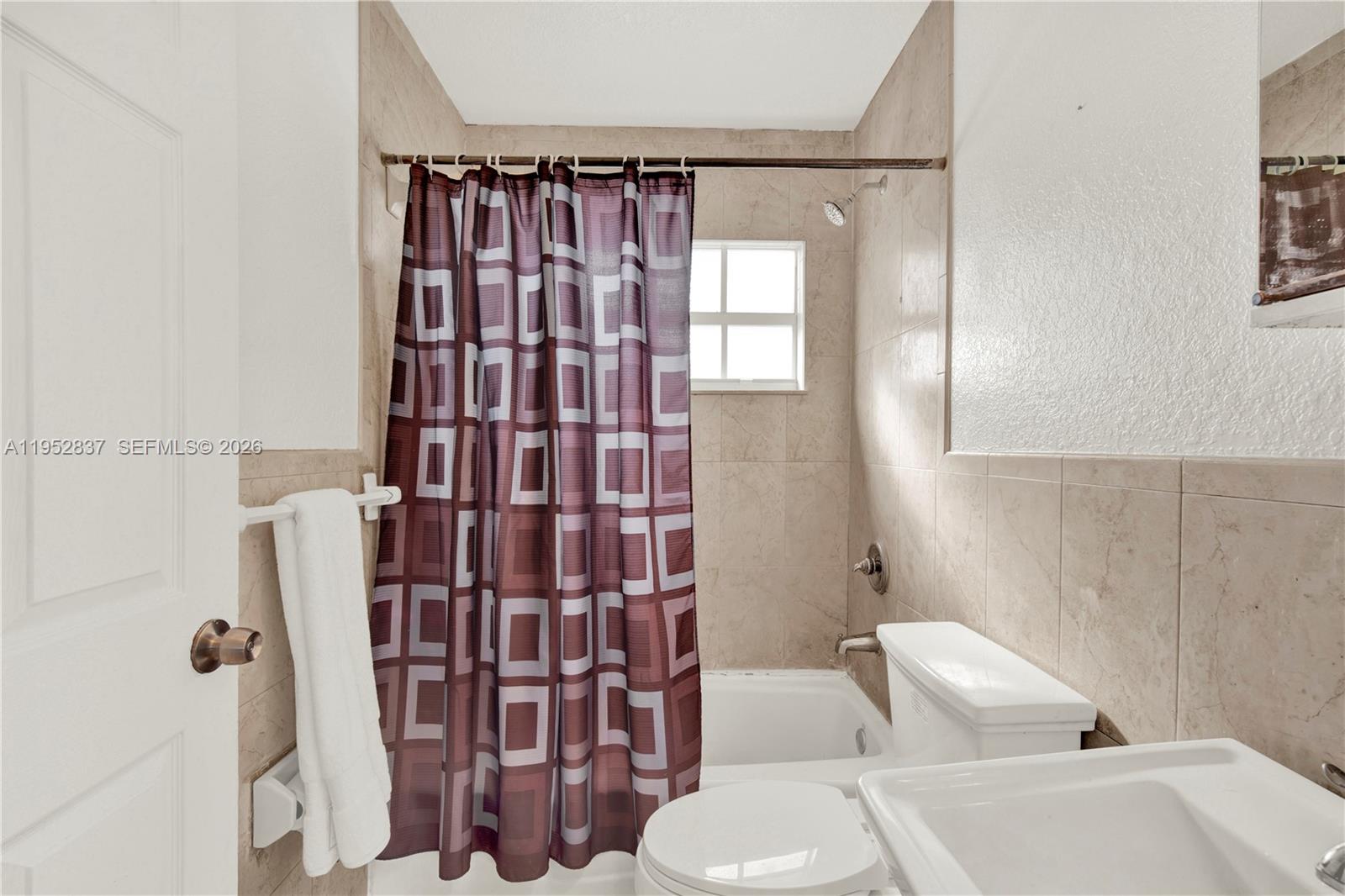 474 East 10th Street Hialeah, FL 33010 - Photo 23 of 38 a bathroom with a shower toilet and sink