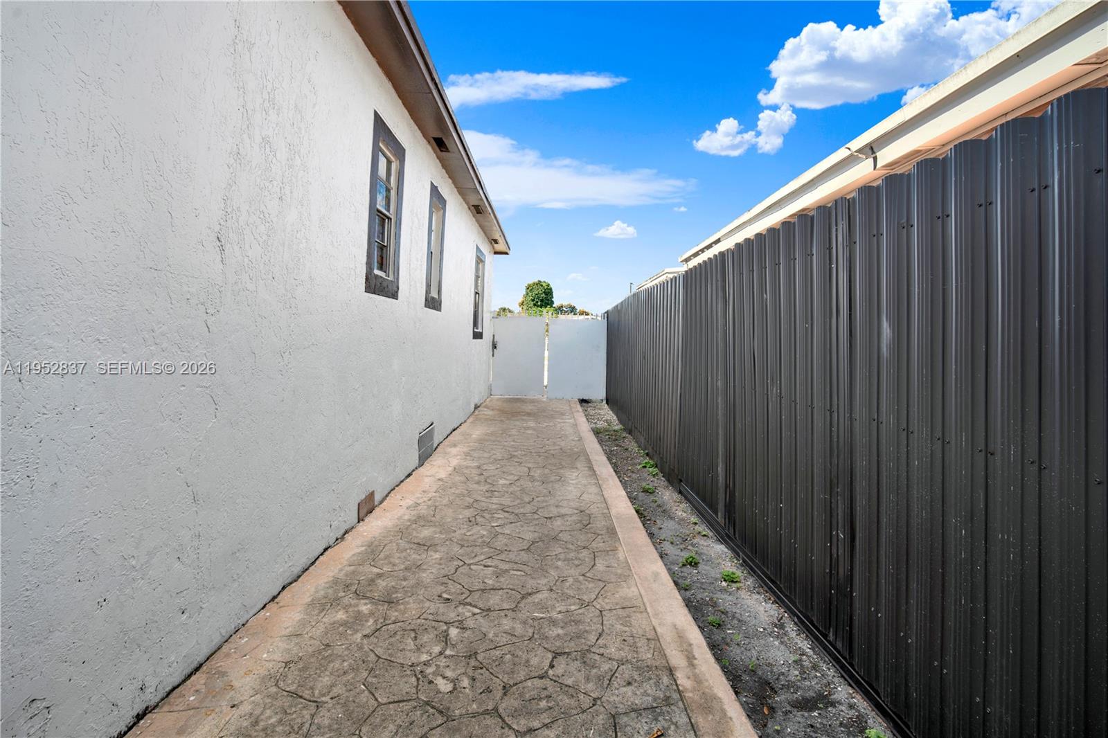 474 East 10th Street Hialeah, FL 33010 - Photo 28 of 38 a view of a pathway of a building